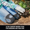 A person wearing denim jeans is using black memory foam knee pads to protect their knees while gardening.