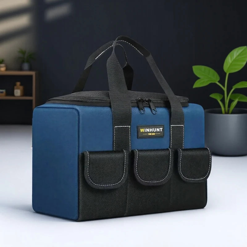 A dark blue and black heavy duty multi-compartment tool organizer bag with padded compartments and carrying straps.