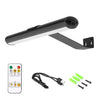 A wall mounted LED picture light fixture with a long bar and a remote control and associated wires.