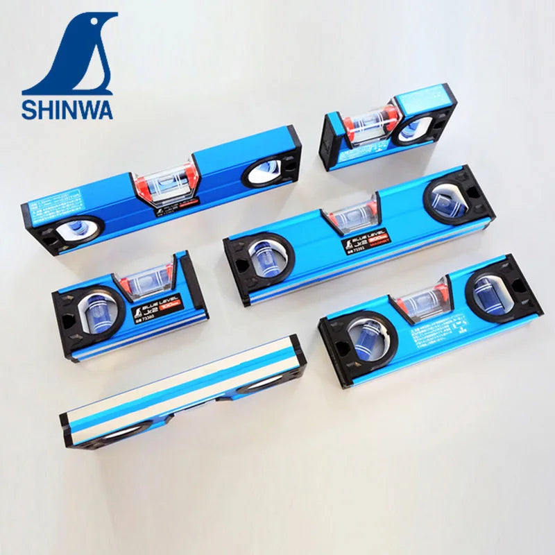 A set of precision bubble level rulers and alignment tools in blue and black packaging.