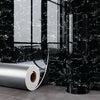 Roll of silver marble wall decals against a black marble background.