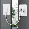 Weißer Klebe-Kabel-Restriktorschloss mit weißer Platte und Rundschlüssel in grauem Türrahmen montiert.