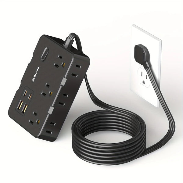 A black multi-port surge power strip with USB charging ports and a power cord plugged into a white wall outlet.