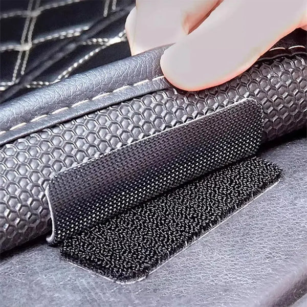 Close-up of heavy duty hook and loop strips being applied to a leather surface.