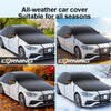 Black all-weather car cover fitted onto a white car, shown in various outdoor settings.