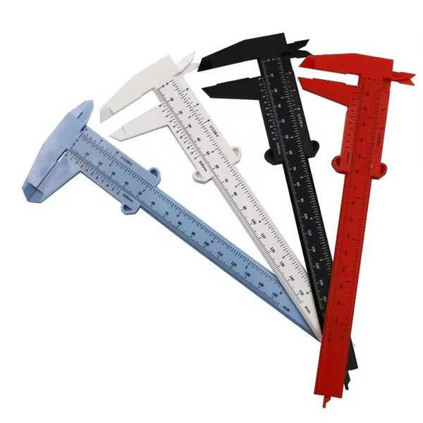 A set of three precision plastic vernier calipers in blue, white, and red.