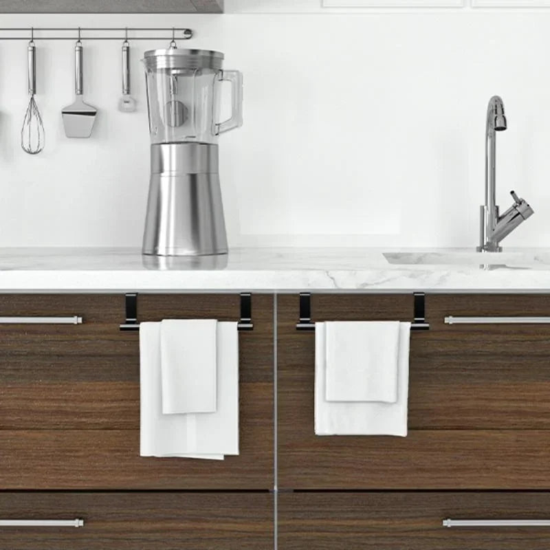 Stainless steel over cabinet towel rack mounted above a kitchen sink and countertop.