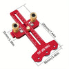 A red precision thin rip table saw jig with a guide bar and two drill bits shown against a measurement scale.