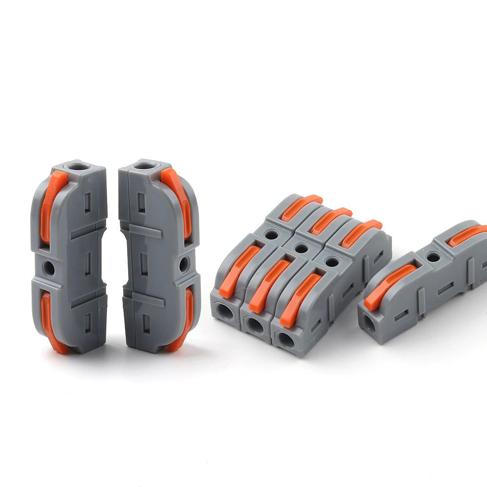 Three gray lever wire connectors with orange grips are shown on a white background.