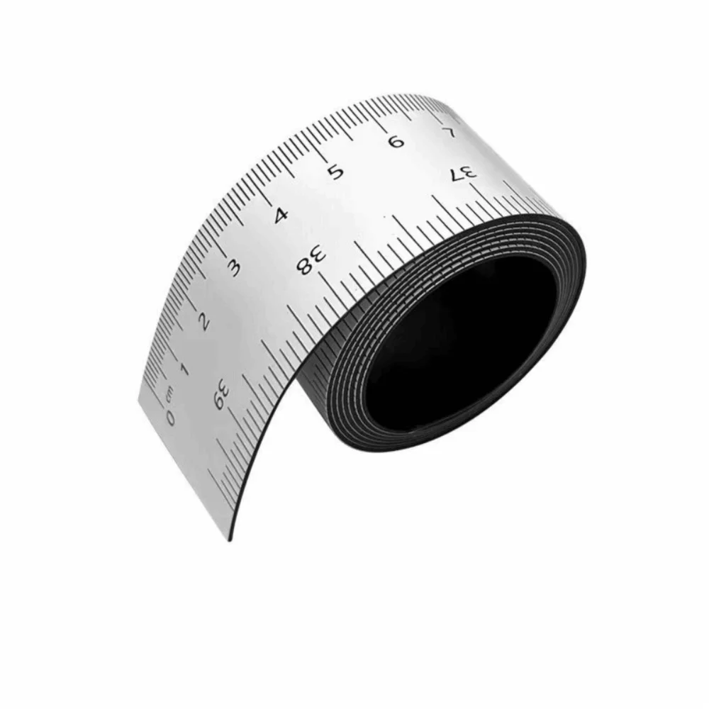 A black magnetic dual scale flexible measuring ruler shown from the side with markings.