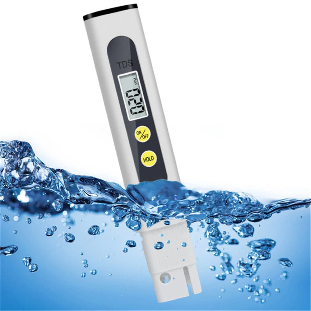 A white digital water quality tester with a display showing 0.20 TDS is shown submerged in blue water.