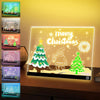 A display of five LED acrylic message boards featuring Christmas and seasonal messages, illuminated with a warm night light.