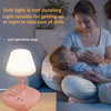 A woman is using a soft light lamp with a baby in a bedroom setting.