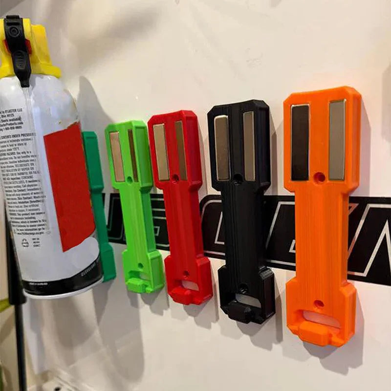 A row of magnetic spray can holders in various colors including yellow, green, red, black, and orange.