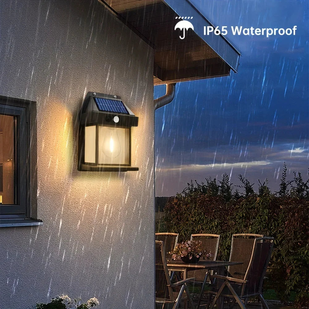An IP65 waterproof solar motion sensor LED wall light mounted on a building exterior during rainfall.