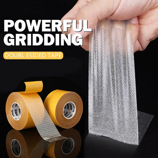 A hand holds a roll of double-sided grid adhesive tape, demonstrating its powerful grid pattern.