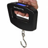 A hand holds a black portable luggage scale with a digital display showing Max: 50kg d=10g