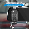 A black car mounted rearview mirror and key holder clip for a smartphone.