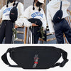 Black linen crossbody waist bag featuring a detailed animal design worn by a person.