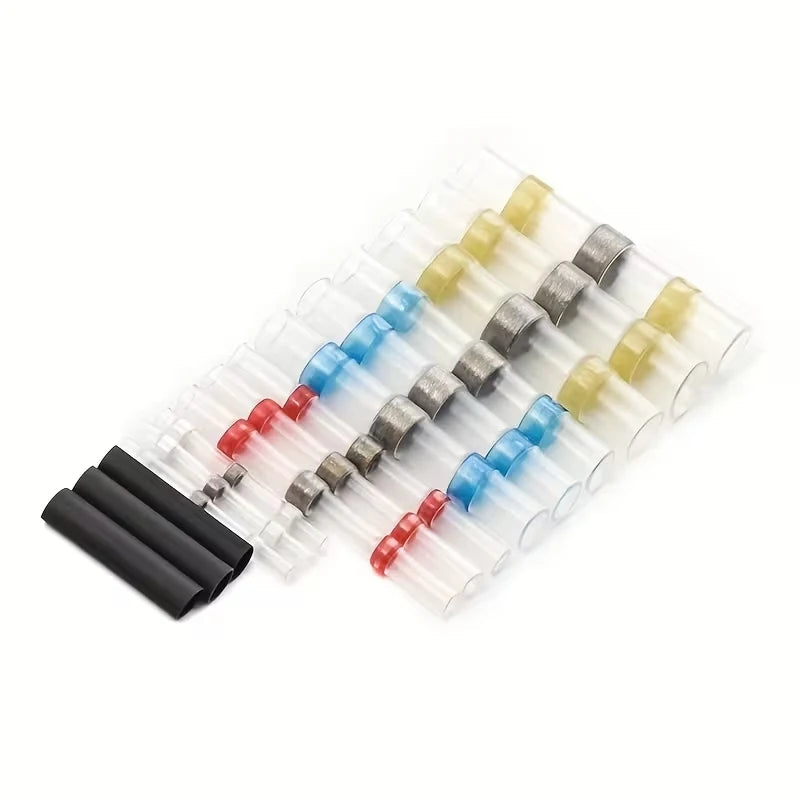A row of bulk solder seal wire connectors in various colors and sizes arranged diagonally on a white background.