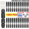 A collection of black photovoltaic connectors for solar panels, packaged with 600 pieces.