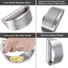 Silver manual stainless steel garlic and ginger press with an ergonomic non-slip handle