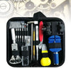 A black professional watch repair tool kit containing various precision tools and instruments.