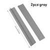 Deux bandes de scellement en silicone gris pour cuisinière à gaz, vues en diagonale.