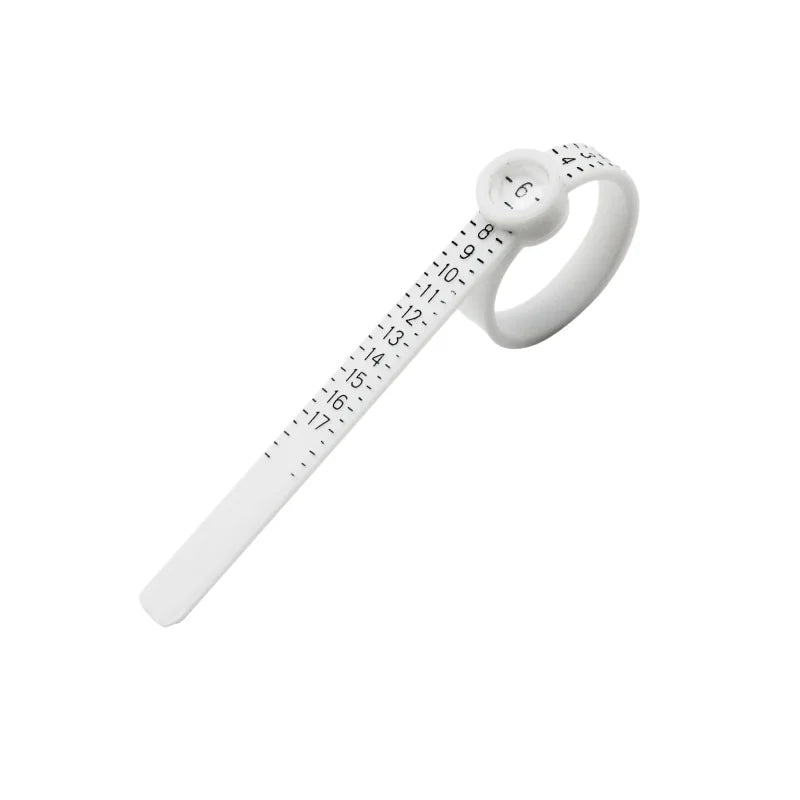 A white precision ring sizer with a magnifying lens and numbered scale.
