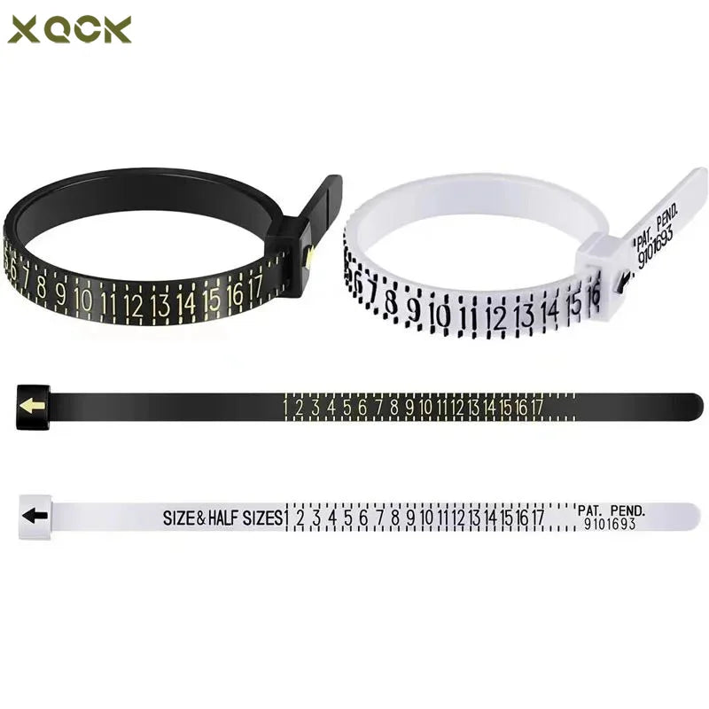 A set of black and white plastic rings used as a precision sizer for jewellery measurement.