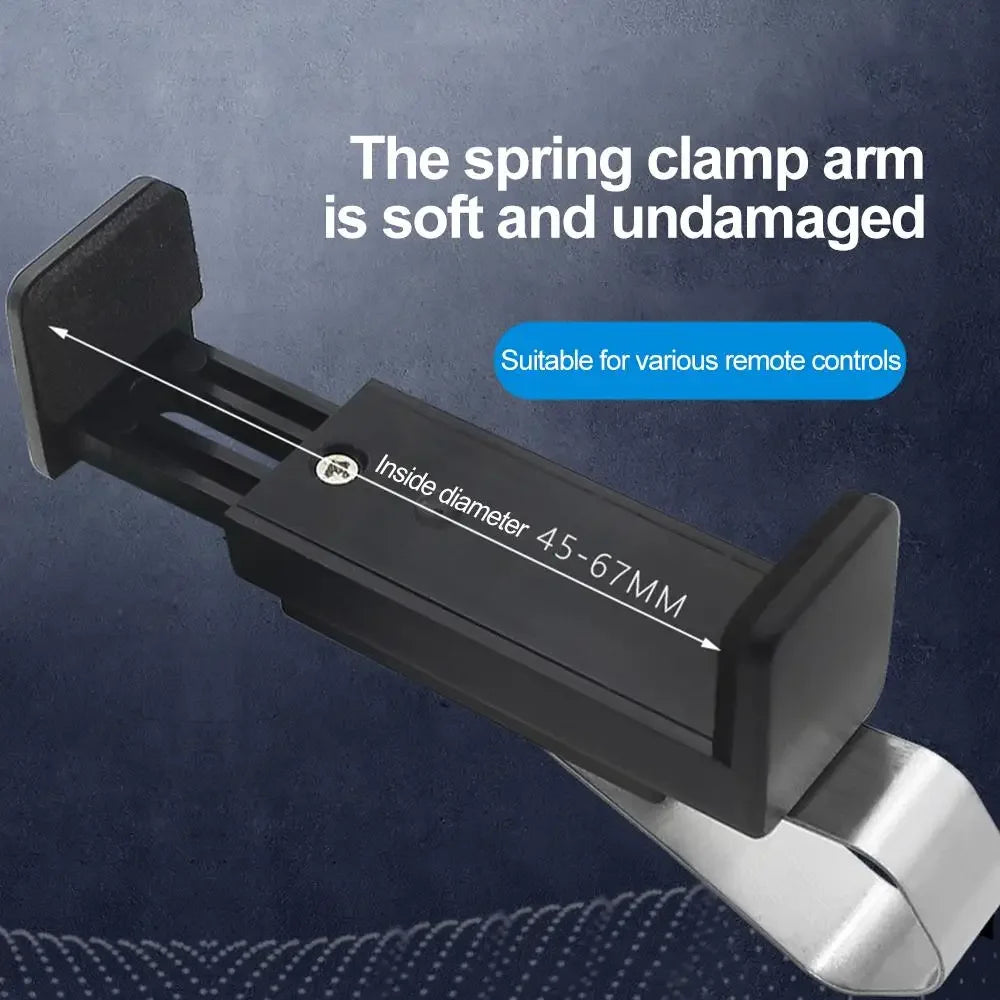 A close-up view of a black spring clamp arm designed to hold remote controls, showing its inside diameter and soft constructi