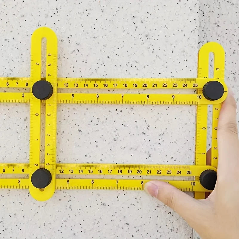A yellow plastic measuring ruler with black markers is shown against a light background.