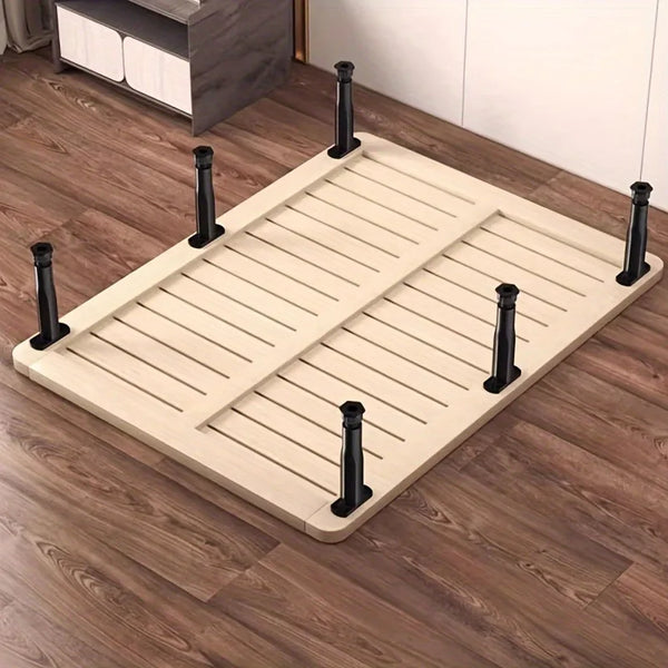 A wooden adjustable bed support panel with six black legs, shown on a brown wooden floor.