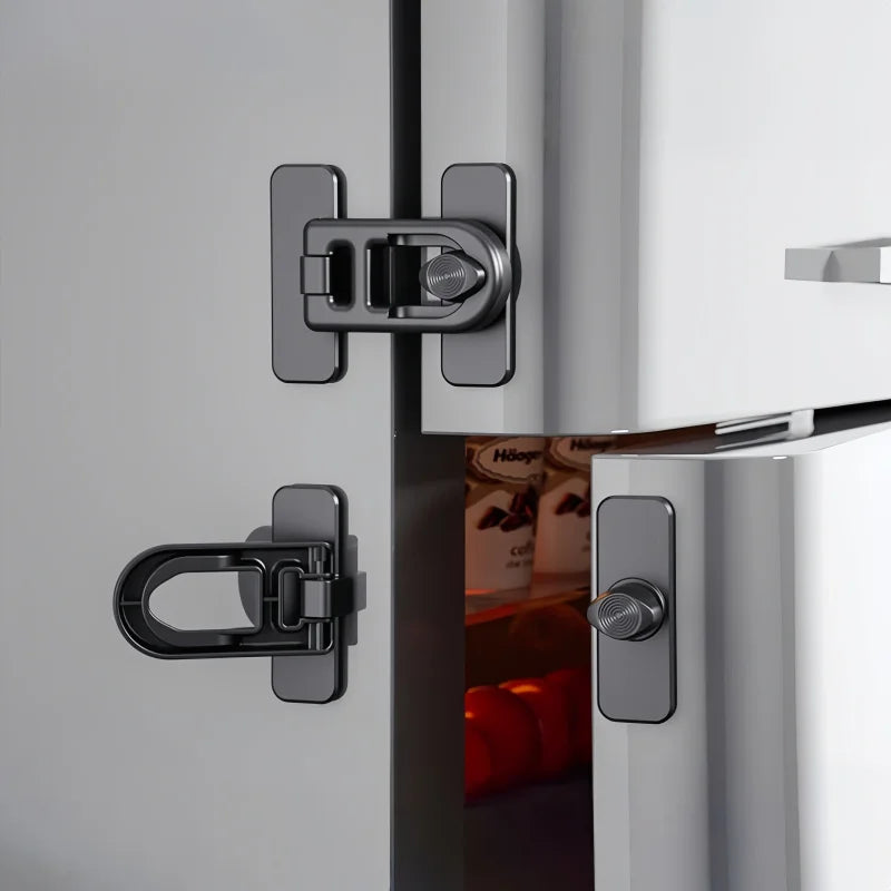 Close-up of a modern silver refrigerator door lock mechanism.
