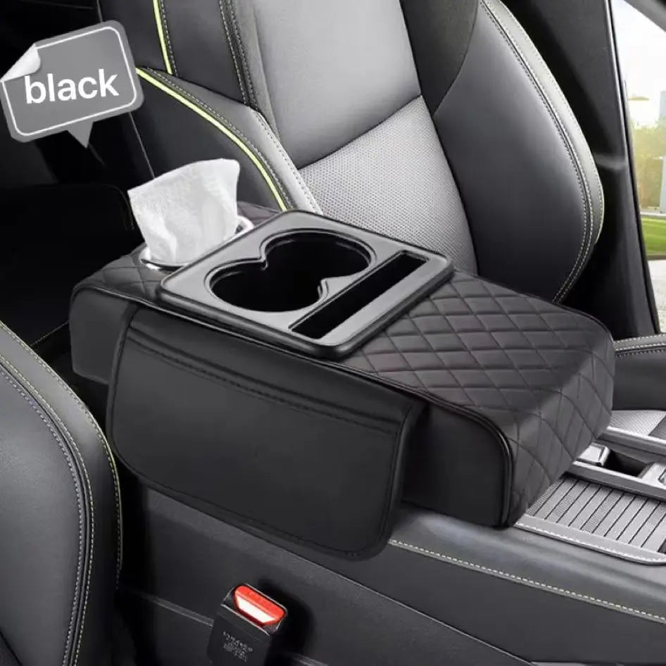 Black car armrest cushion with cup holders installed in a vehicle interior.