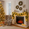 LED rattan garland draped over a white fireplace mantel decorated with gold lights and greenery.