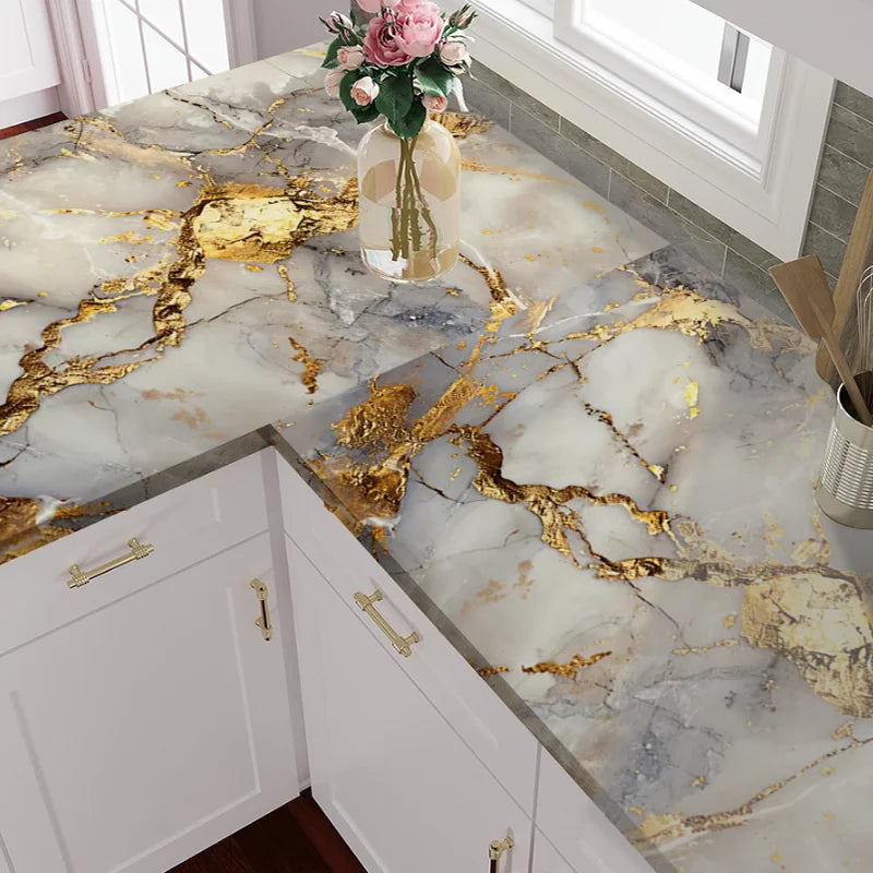 Marble decor film featuring white marble with gold veining on a countertop surface.