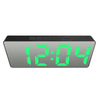 A digital weather station clock displaying the time 12:04 with bright green LED digits.