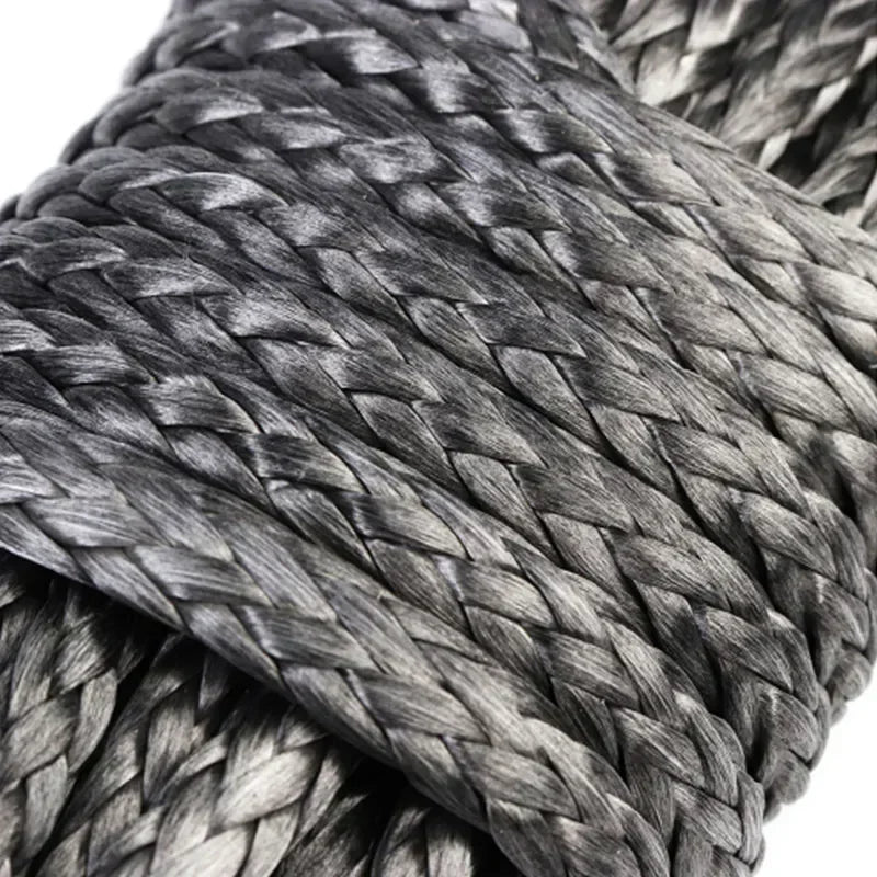 Close-up of a dark gray heavy-duty synthetic tow strap woven into a thick rope texture.