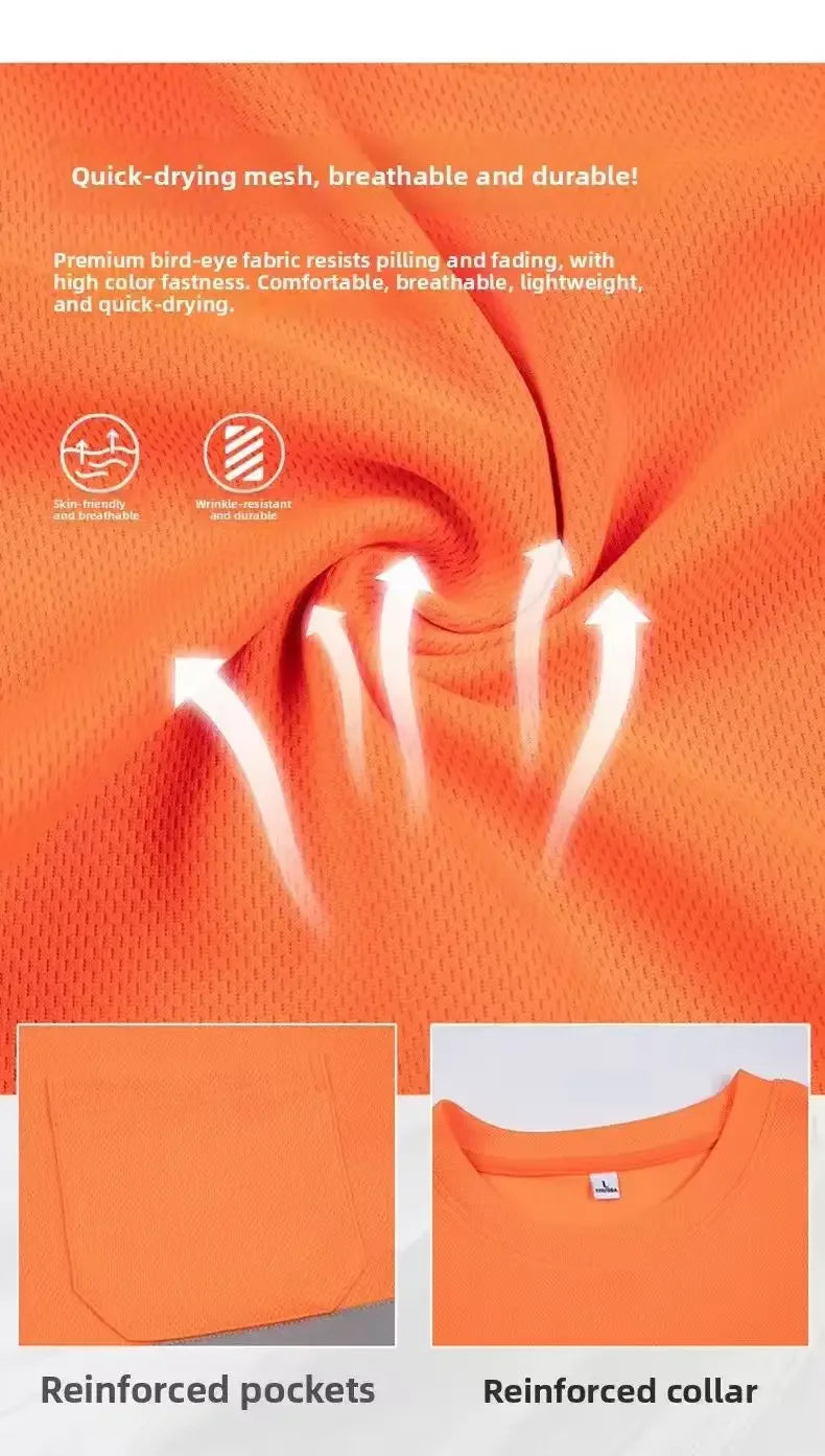 Close-up of an orange high visibility fluorescent work shirt showing reinforced pockets and collar details.