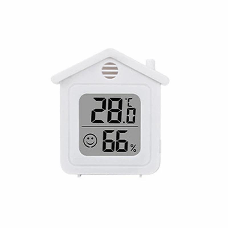 Termómetro digital y higrómetro blanco compacto con techo inclinado mostrando 28.6 grados y 66 por ciento de humedad