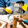 A close-up of a hand using a 1/4 inch hex shank screwdriver bit holder to drive a screw into wood.