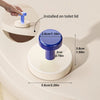A blue suction cup hook installed on a white toilet lid, showing its dimensions.