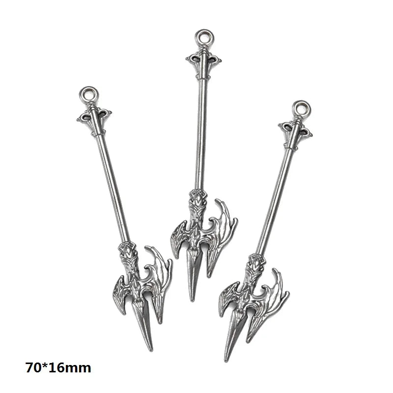 A set of three silver-toned alloy charms featuring ornate, stylized sword or dagger designs for DIY jewelry making.