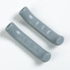 Two gray silicone brake lever protector covers for bicycles shown diagonally.