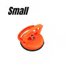 An orange heavy-duty suction cup dent puller tool.