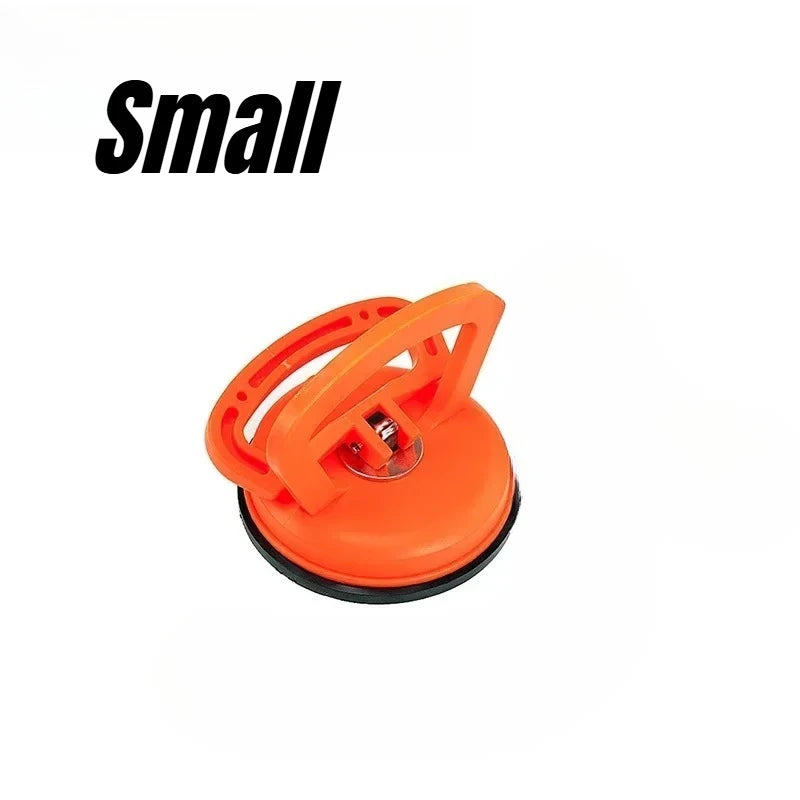 An orange heavy-duty suction cup dent puller tool.