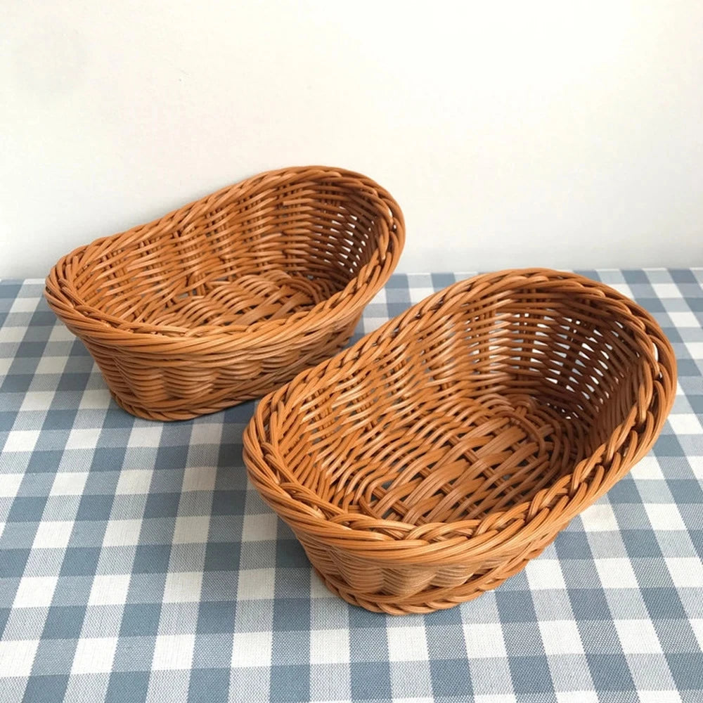 A natural rattan woven serving basket sitting on a blue and white checkered cloth.