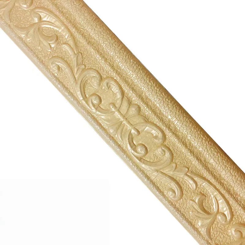Close-up of gold metallic 3D pattern self-adhesive wall trim decal with ornate scrollwork.