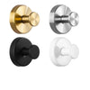 Three suction cup hooks in brass, silver, and matte black finishes.